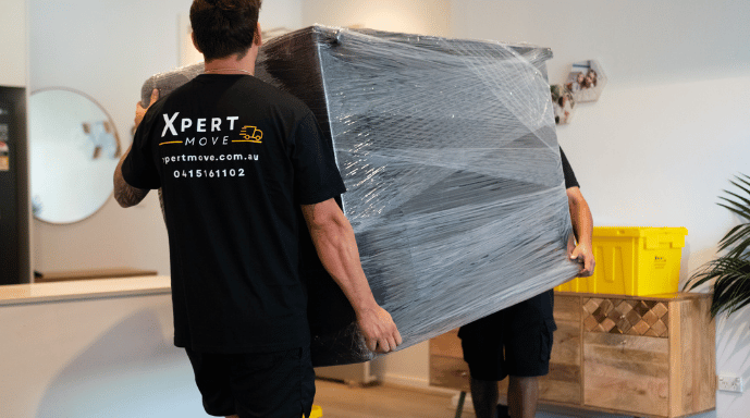 Home Professional removalists carrying furniture during house move in Sydney